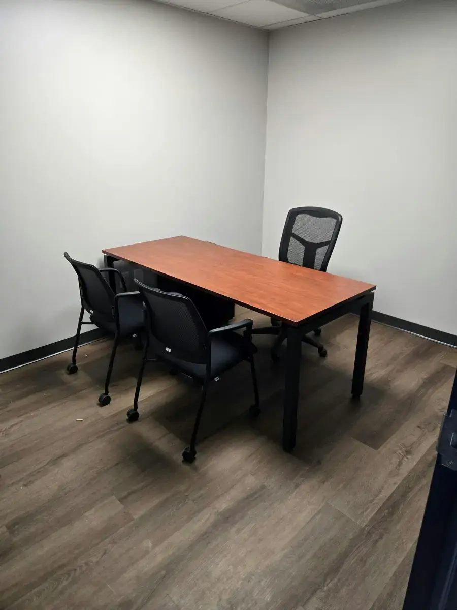 Let Us Help Build Your Next Workspace Small private office with a wooden desk, two guest chairs and a mesh task chair